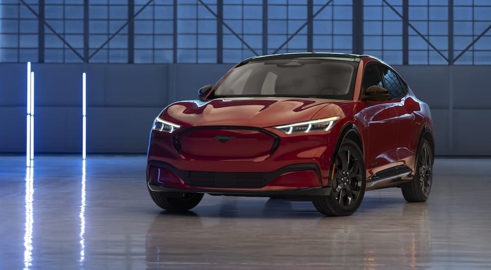 A 2023 Ford Mustang Mach-E is shown parked at an EV dealer.