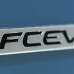 An FCEV badge is shown on hydrogen cars.