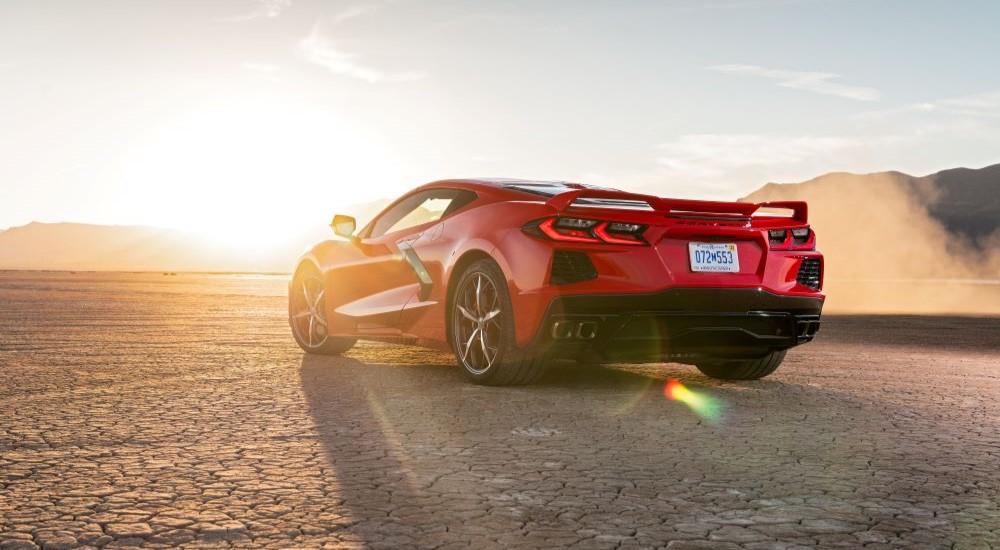 A red 2020 Chevy Corvette is shown on a sunny day after leaving a used Chevy dealer.