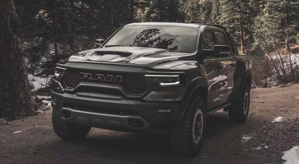 A gray 2023 Ram 1500 TRX is shown parked off-road.