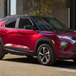 A red 2021 Chevy Trailblazer is shown parked on a street.