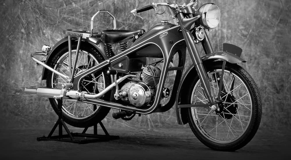 A 1940's Honda motorcycle is shown.