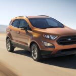 A gold 2020 Ford Ecosport is shown from the front at an angle after leaving a used Ford dealer.