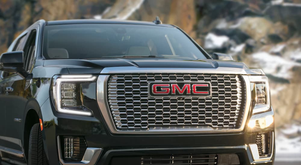 A close-up of a black 2021 GMC Yukon is shown.