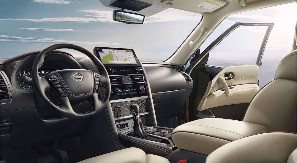 The black and white interior and dash of a 2023 Nissan Armada is shown.