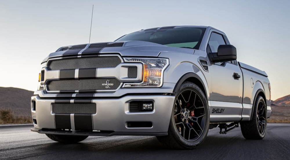 A silver 2023 Ford Shelby F-150 Super Snake Sport is shown parked on a track after viewing Ford trucks for sale.