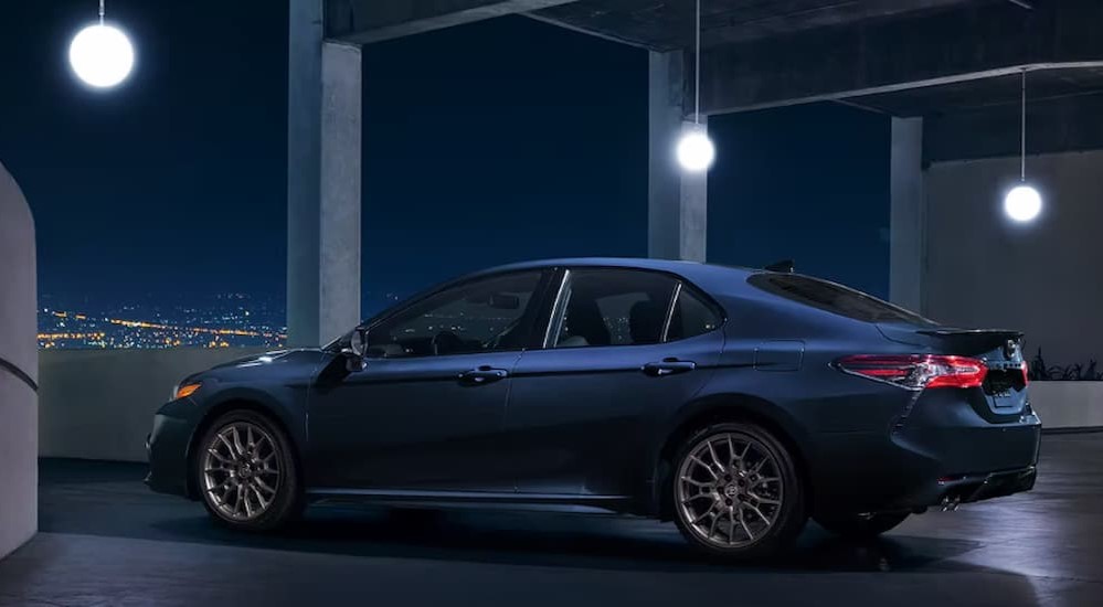 A blue 2023 Toyota Camry is shown parked after participating in a 2023 Honda Accord vs 2023 Toyota Camry comparison.