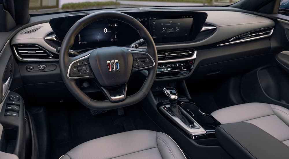 The grey interior of a 2024 Buick Envista is shown from the driver's seat.