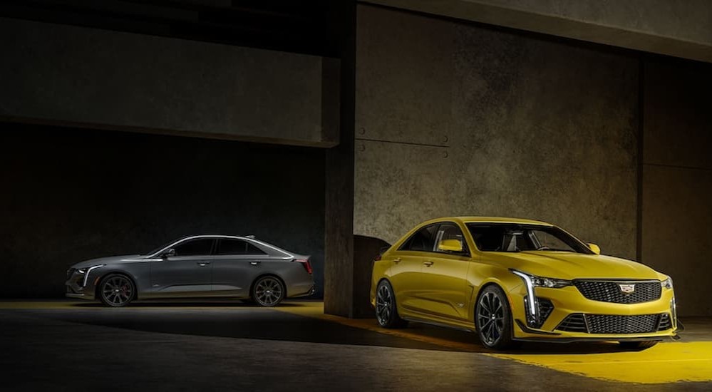 A gray and yellow 2023 Cadillac CT4 V-Blackwing are shown parked in a garage.