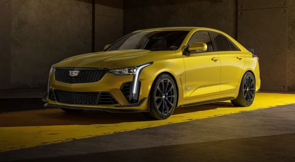 A yellow 2023 Cadillac CT4 V-Blackwing is shown parked on yellow paint.