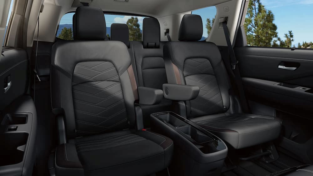 The black and brown rear seat interior of a 2023 Nissan Pathfinder is shown.