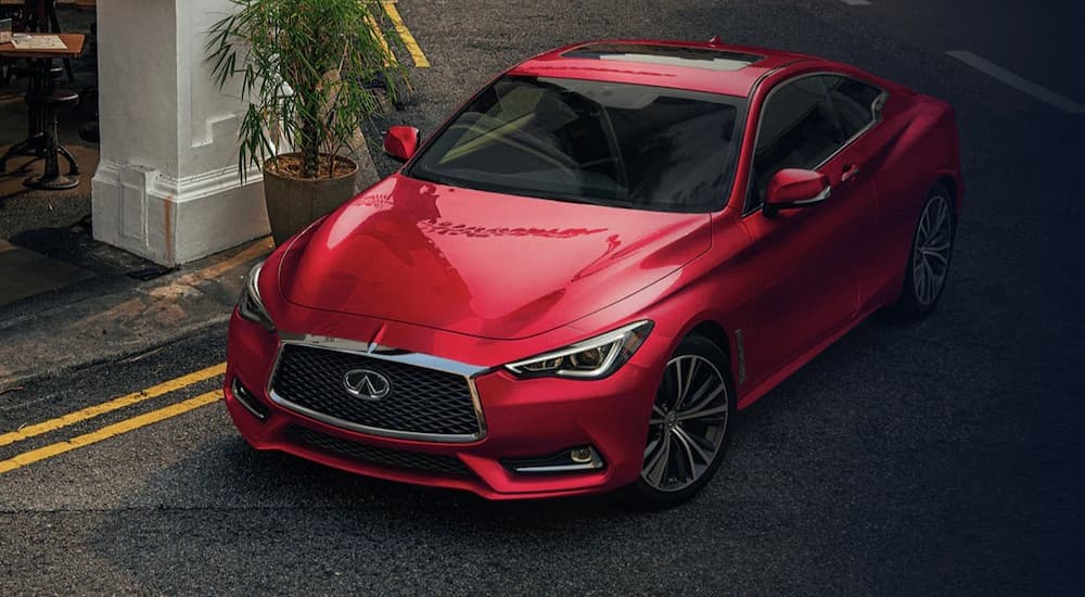 After discussing "Will Infiniti survive?" A red 2023 Infiniti Q60 is shown parked near a restaurant.