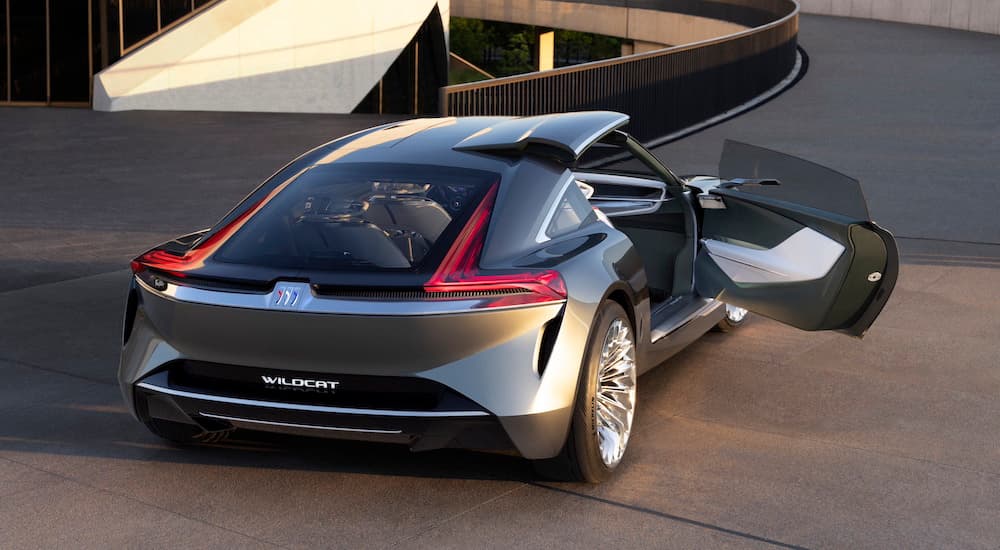 A silver Buick Wildcat EV concept is shown from the rear at an angle.