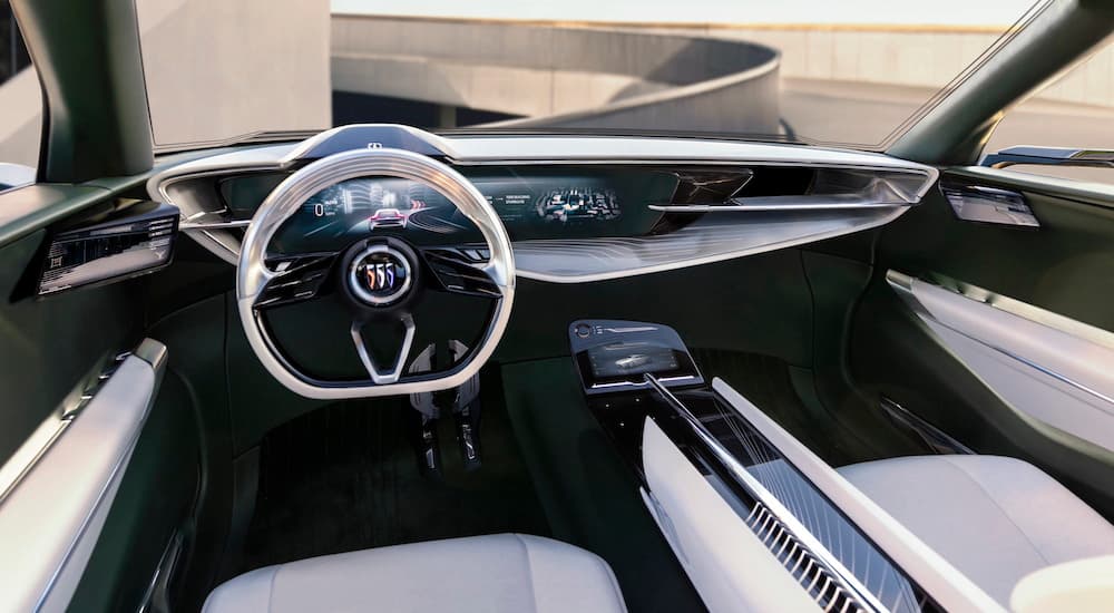 The white interior of the Buick Wildcat EV concept is shown from the driver's seat.