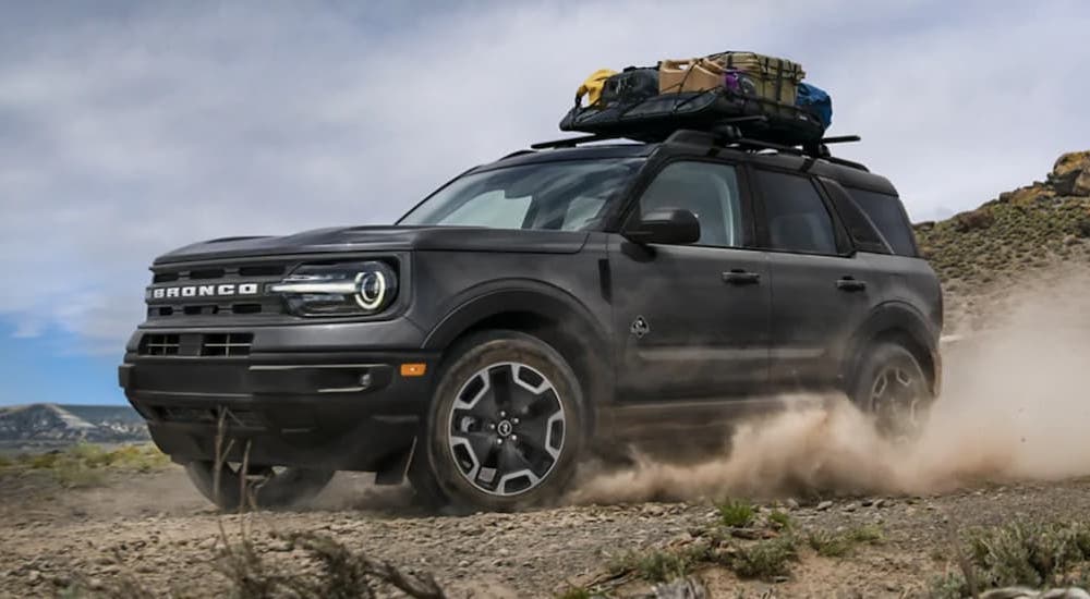 A black 2021 Ford Bronco Sport is shown from the side.
