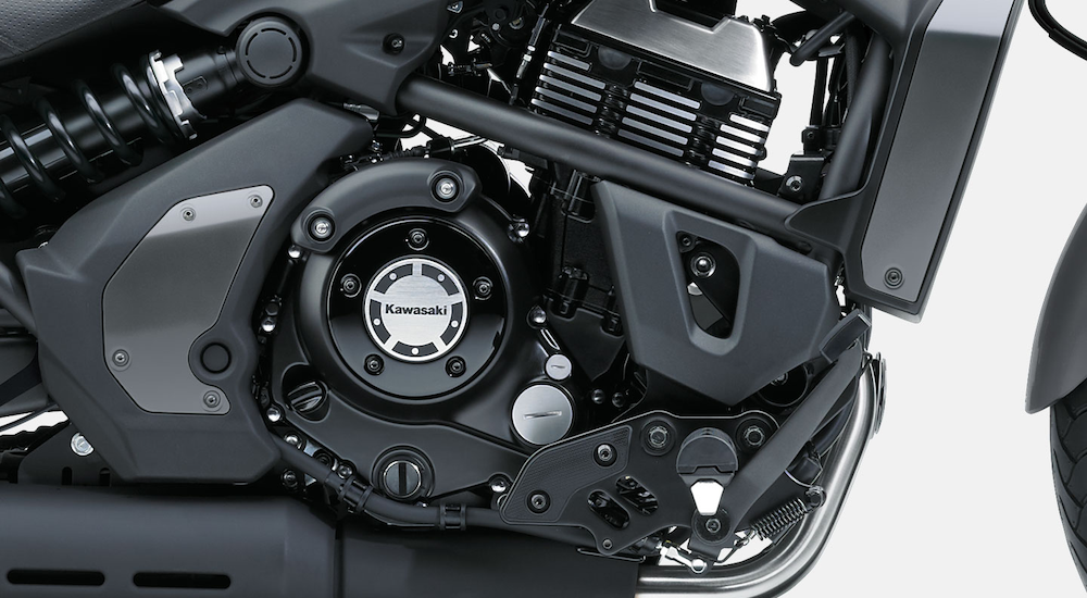 A close-up of an engine on a black 2022 Kawasaki Vulcan S.