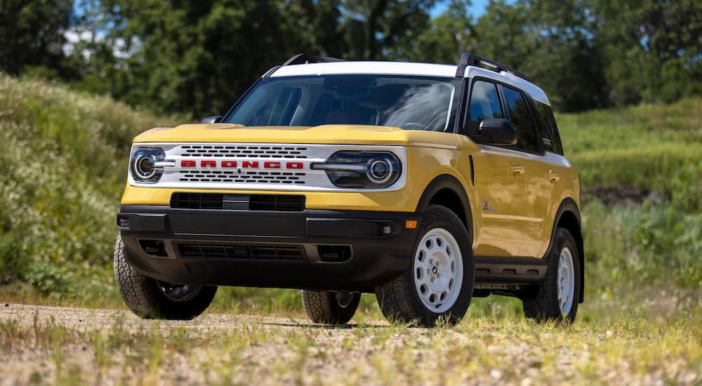 A yellow 2023 Ford Bronco Sport Heritage Edition is shown from the front after leaving a Ford dealer.