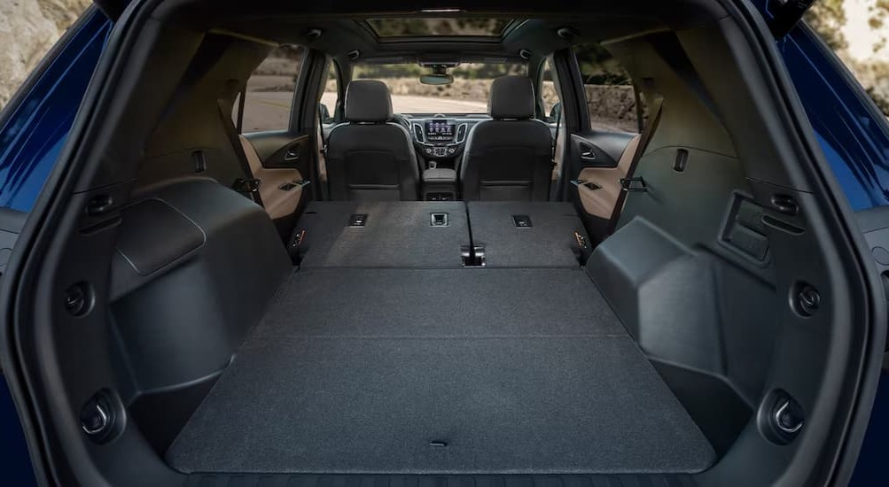 The gray interior cargo space of a 2023 Chevy Equinox LS is shown.