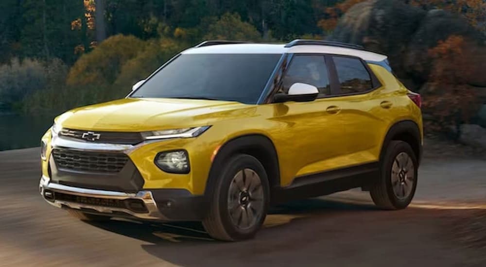 A yellow 2023 Chevy Trailblazer is shown parked after viewing Chevy SUVs for sale.