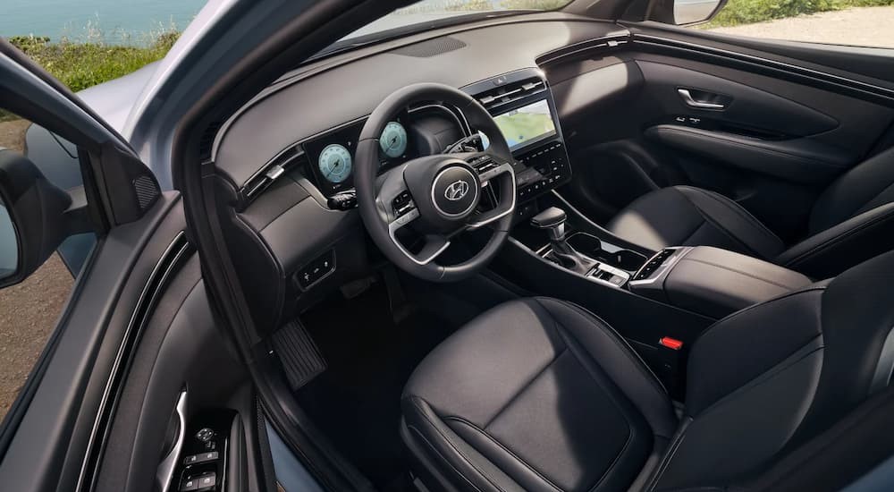 The black interior and dash of a 2023 Hyundai Santa Cruz is shown.