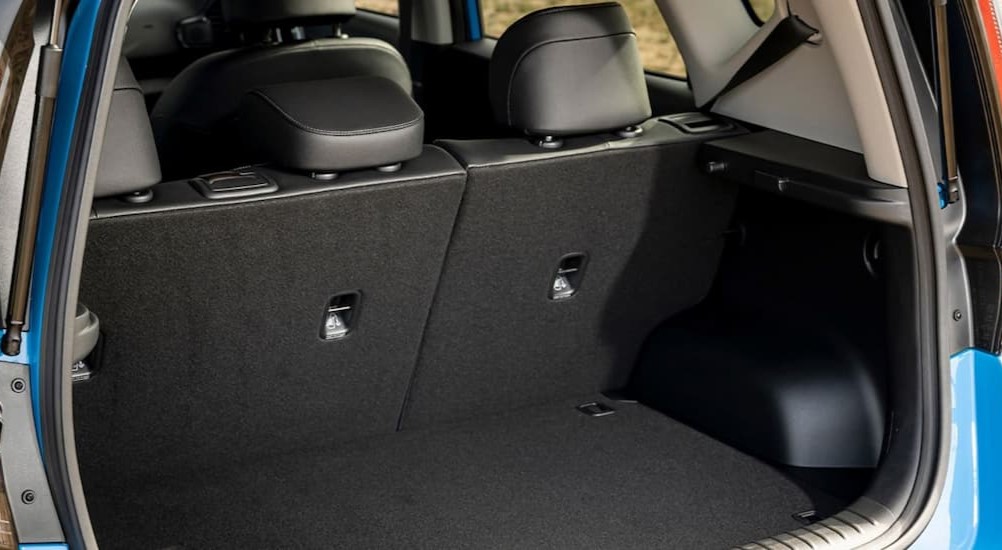 The black interior cargo space of a 2023 Kia Soul is shown.