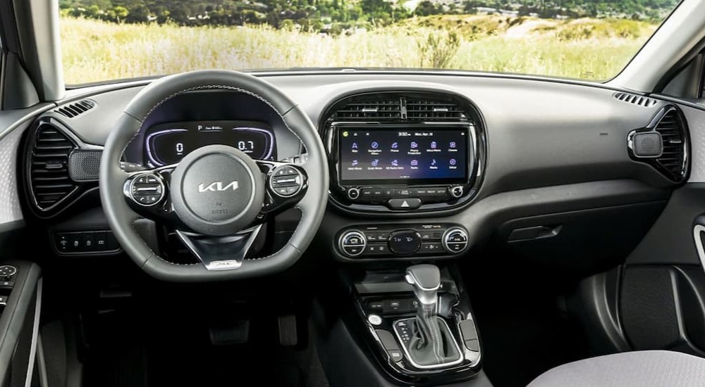 The black interior and dash of a 2023 Kia Soul is shown.