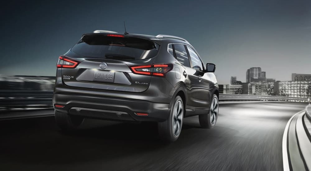 A metallic 2022 Nissan Rogue Sport is shown driving on an on-ramp.