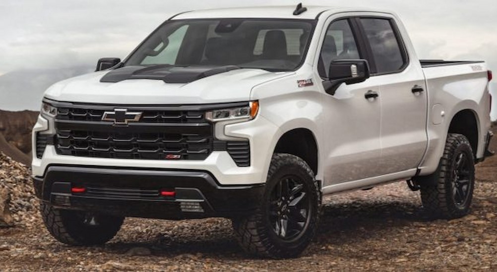 A white 2023 Chevy Silverado 1500 LT Trail Boss is shown parked after viewing a Chevy Silverado for sale.
