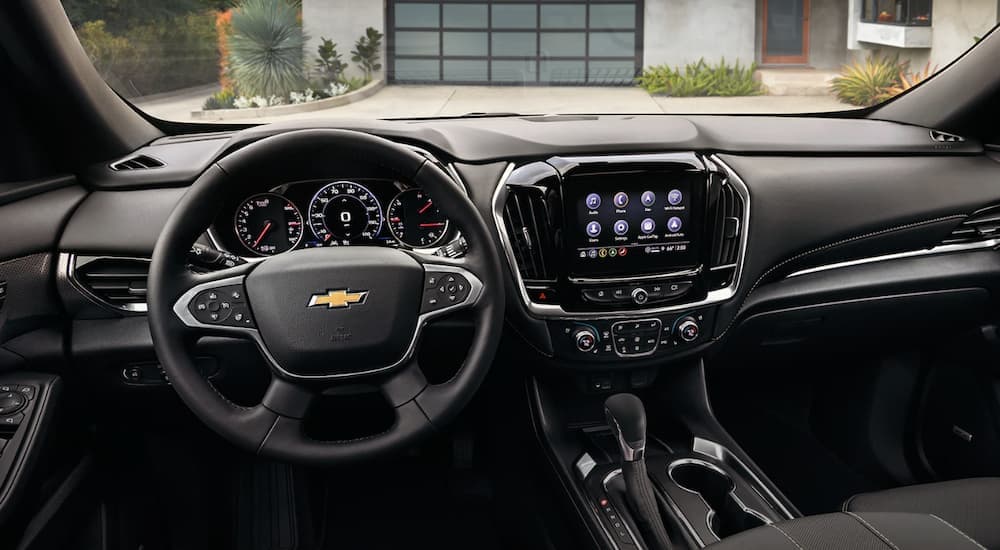 The black interior and dash of a 2022 Chevy Traverse is shown.