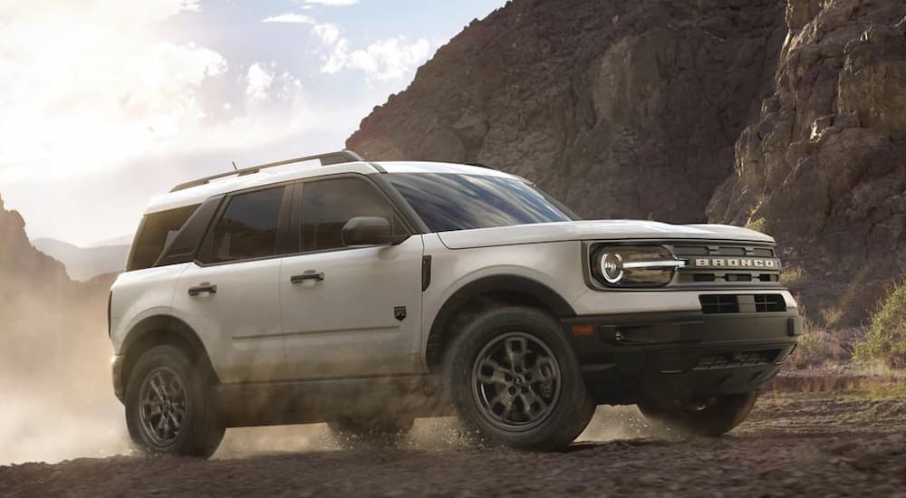 A white 2022 Ford Bronco Sport Big Bend is shown from the side while off-road.