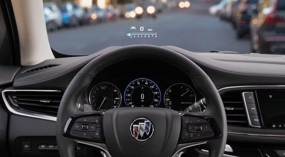 The black interior and dash of a 2023 Buick Enclave is shown.