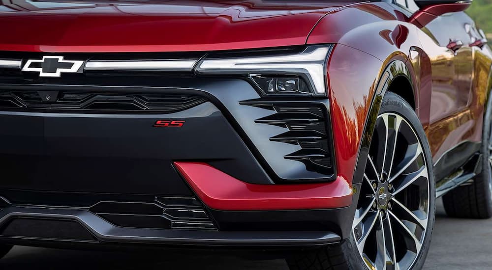 A close up of the grille on a red 2024 Chevy Blazer EV SS is shown.