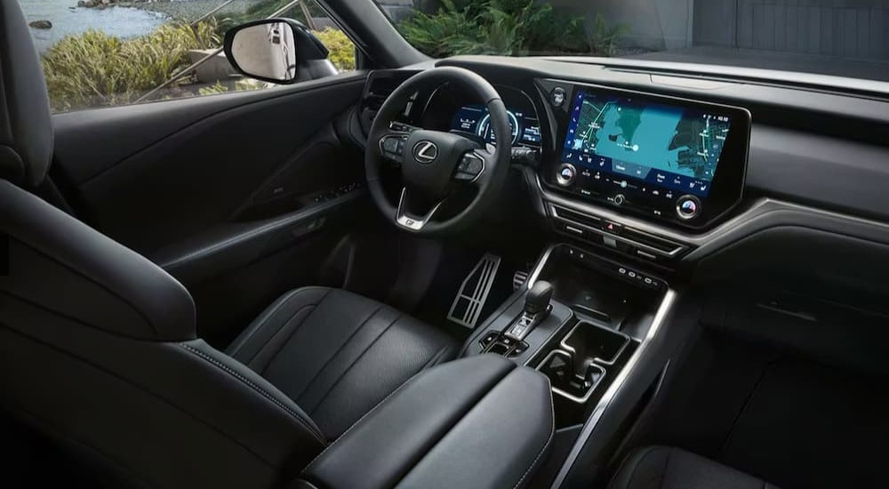 The black interior and dash of a 2024 Lexus TX is shown.