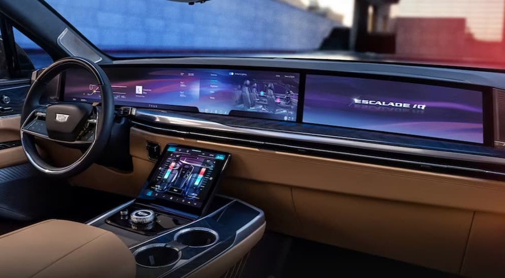 The black and brown interior and dash of a 2025 Cadillac Escalade IQ is shown.