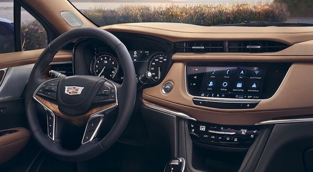 The interior of a 2024 Cadillac XT5, including the wheel and dashboard.