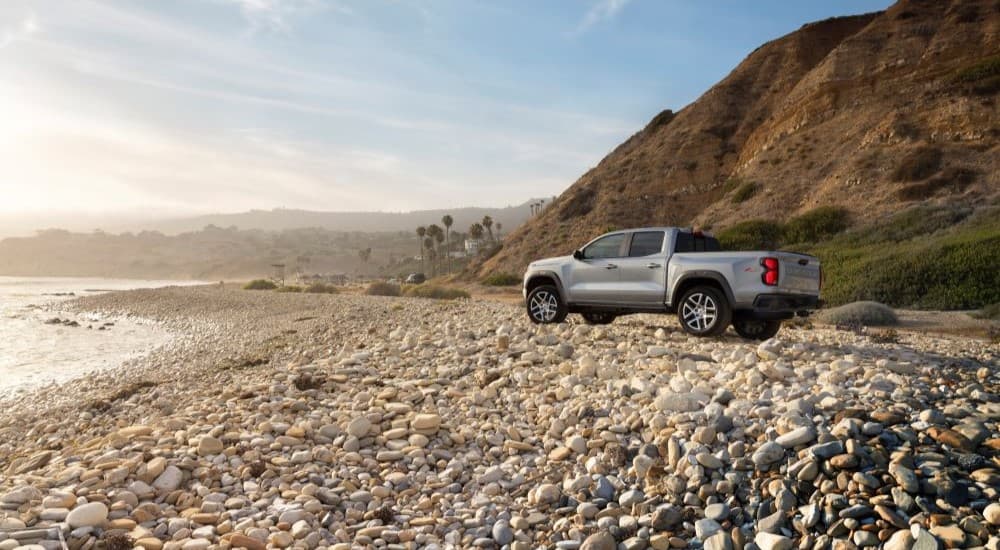 A silver 2023 Chevy Colorado Z71 is shown parked near the ocean.