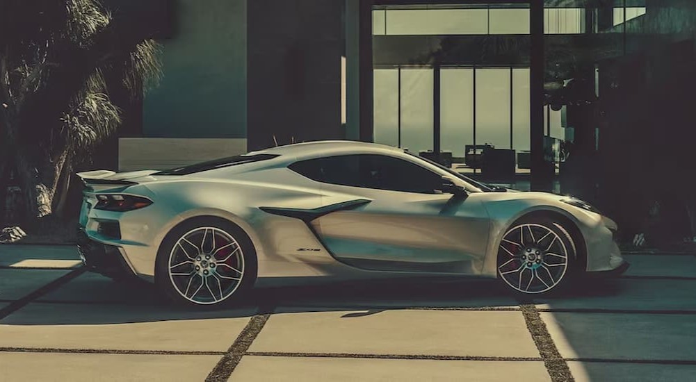 A silver 2023 Chevy Corvette ZO6 is shown parked on a driveway.