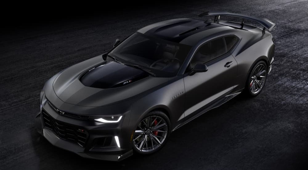 A black 2024 Chevrolet Camaro ZL1 is shown parked on a black surface.