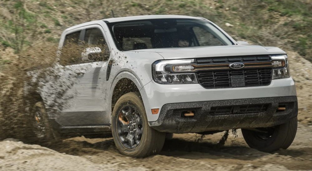 A white 2024 Ford Maverick Tremor is shown driving off-road.