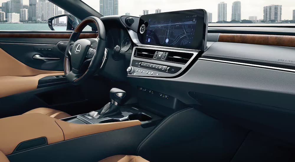 The brown-and-black interior of a 2024 Lexus ES is shown.