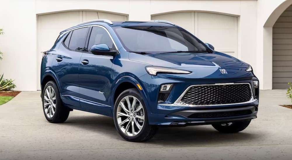 A blue 2024 Buick Encore Gx is shown parked on a driveway.