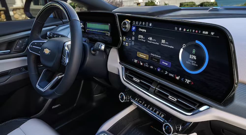 The black and white interior and dash of a 2024 Chevy Equinox EV is shown.