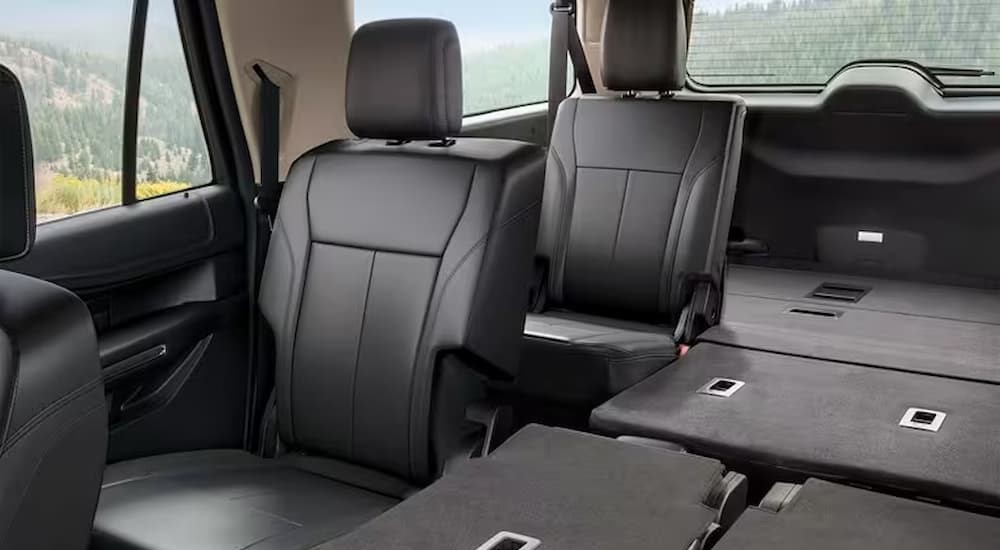 The black and white rear interior and cargo area of a 2024 Ford Expedition XLT MAX is shown.