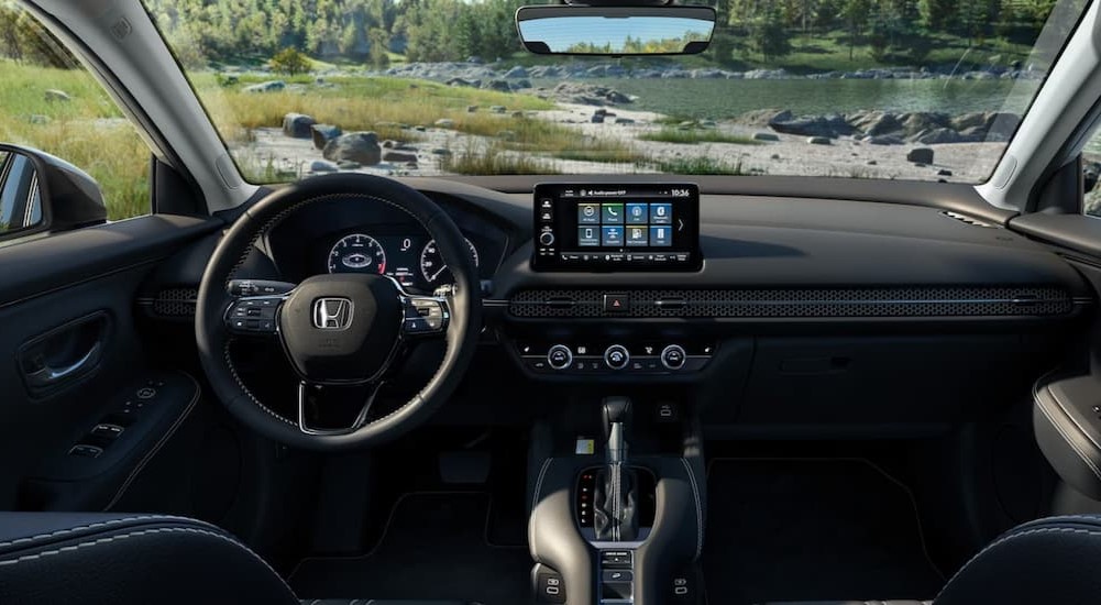 The black interior and dash of a 2024 Honda HR-V is shown.