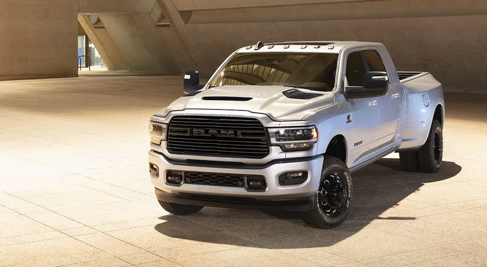 A white 2024 Ram 3500HD is shown parked on a buildings floor.