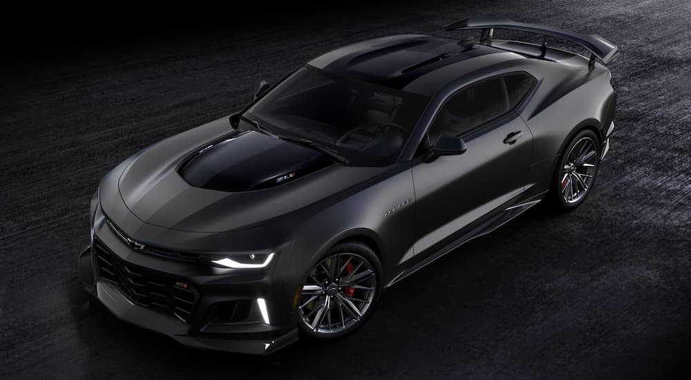 A black 2024 Chevy Camaro ZL1 is shown from the front at a high angle.