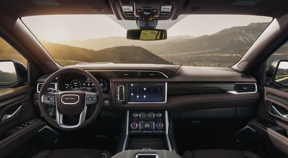 The brown interior of a 2024 GMC Yukon XL Denali Ultimate is shown.