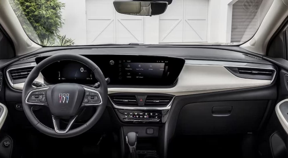 The black interior and dash of a 2024 Buick Encore GX is shown.