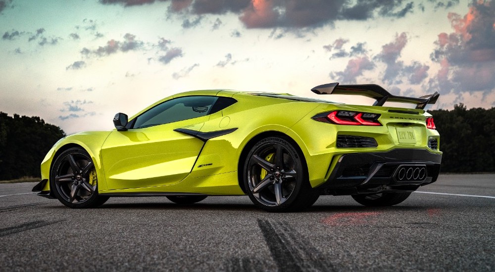 A green 2024 Chevy Corvette Z06 is shown parked on a track.