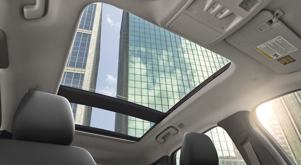 A sunroof is shown from the interior of a 2024 Ford Escape Platinum.